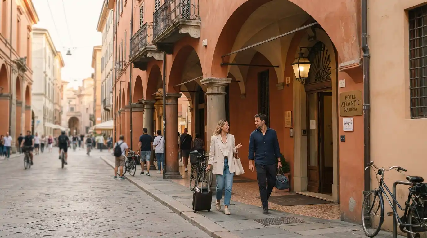 Hotel entrance along a traditional porticoed street in central Bologna