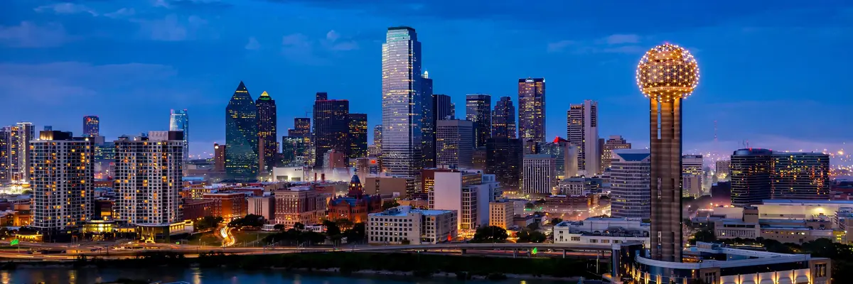 Best hotels in Dallas – downtown skyline with Reunion Tower glowing at blue hour